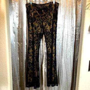 Nylon/spandex bell bottom pants. Black lace with tan lining